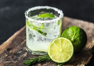 lime beverage in clear glass