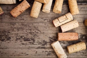 wine corks on a wood background